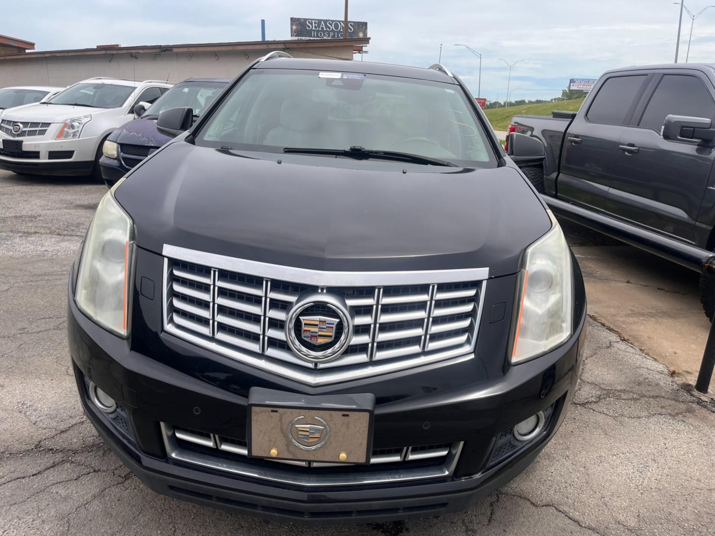 2014 BLACK Cadillac SRX Performance Collection AWD (3GYFNFE31ES) with an 3.6L V6 DOHC 24V FFV engine, 6-Speed Automatic transmission, located at 8101 E. Skelly Dr., Tulsa, OK, 74129, (918) 592-3593, 36.121891, -95.888802 - Photo#2