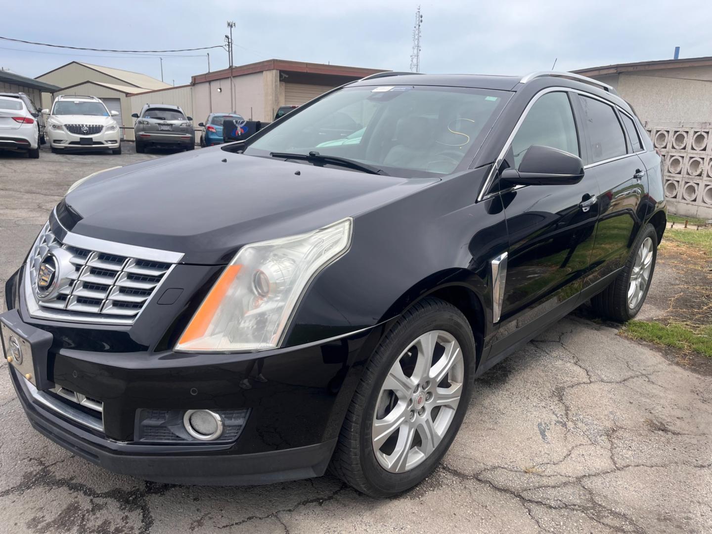 2014 BLACK Cadillac SRX Performance Collection AWD (3GYFNFE31ES) with an 3.6L V6 DOHC 24V FFV engine, 6-Speed Automatic transmission, located at 8101 E. Skelly Dr., Tulsa, OK, 74129, (918) 592-3593, 36.121891, -95.888802 - Photo#0
