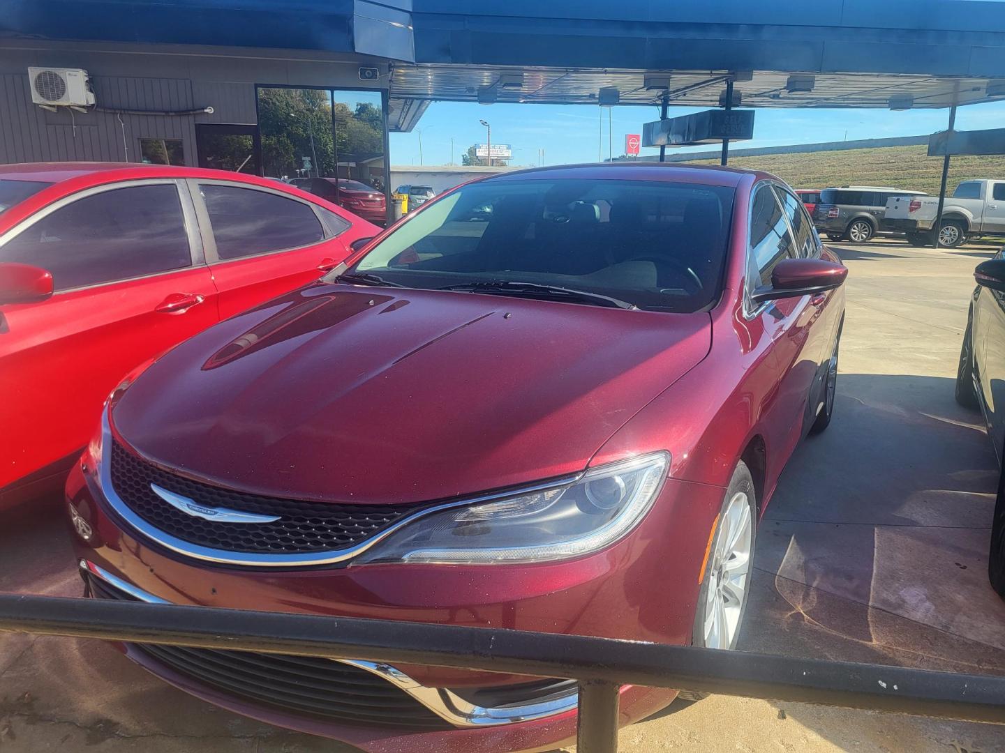 2016 RED Chrysler 200 Limited (1C3CCCAB5GN) with an 2.4L L4 DOHC 16V engine, 9A transmission, located at 8101 E. Skelly Dr., Tulsa, OK, 74129, (918) 592-3593, 36.121891, -95.888802 - Photo#0