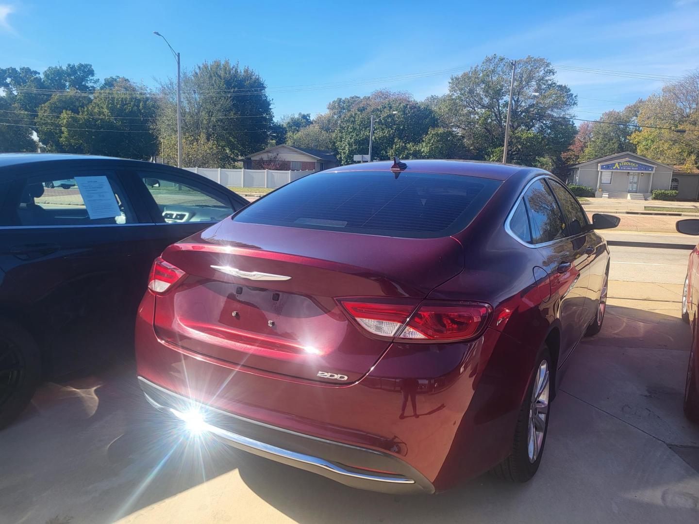 2016 RED Chrysler 200 Limited (1C3CCCAB5GN) with an 2.4L L4 DOHC 16V engine, 9A transmission, located at 8101 E. Skelly Dr., Tulsa, OK, 74129, (918) 592-3593, 36.121891, -95.888802 - Photo#1