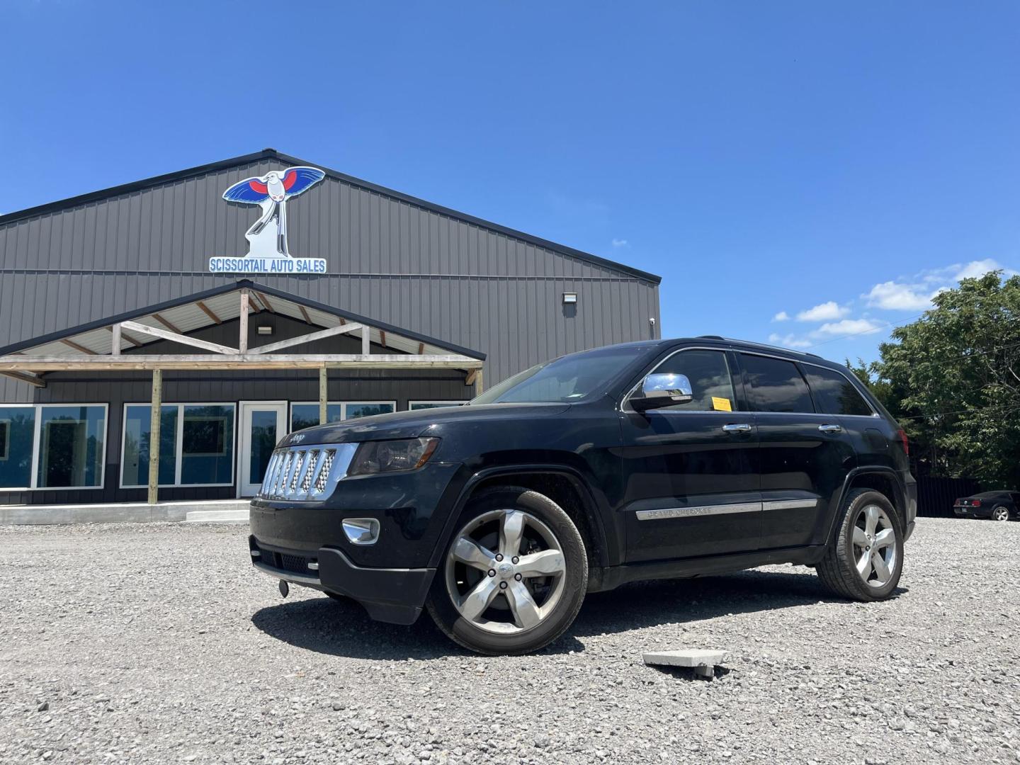 2012 BLACK Jeep Grand Cherokee Overland 4WD (1C4RJFCT8CC) with an 5.7L V8 OHV 16V engine, 5-Speed Automatic transmission, located at 8101 E. Skelly Dr., Tulsa, OK, 74129, (918) 592-3593, 36.121891, -95.888802 - Photo#0