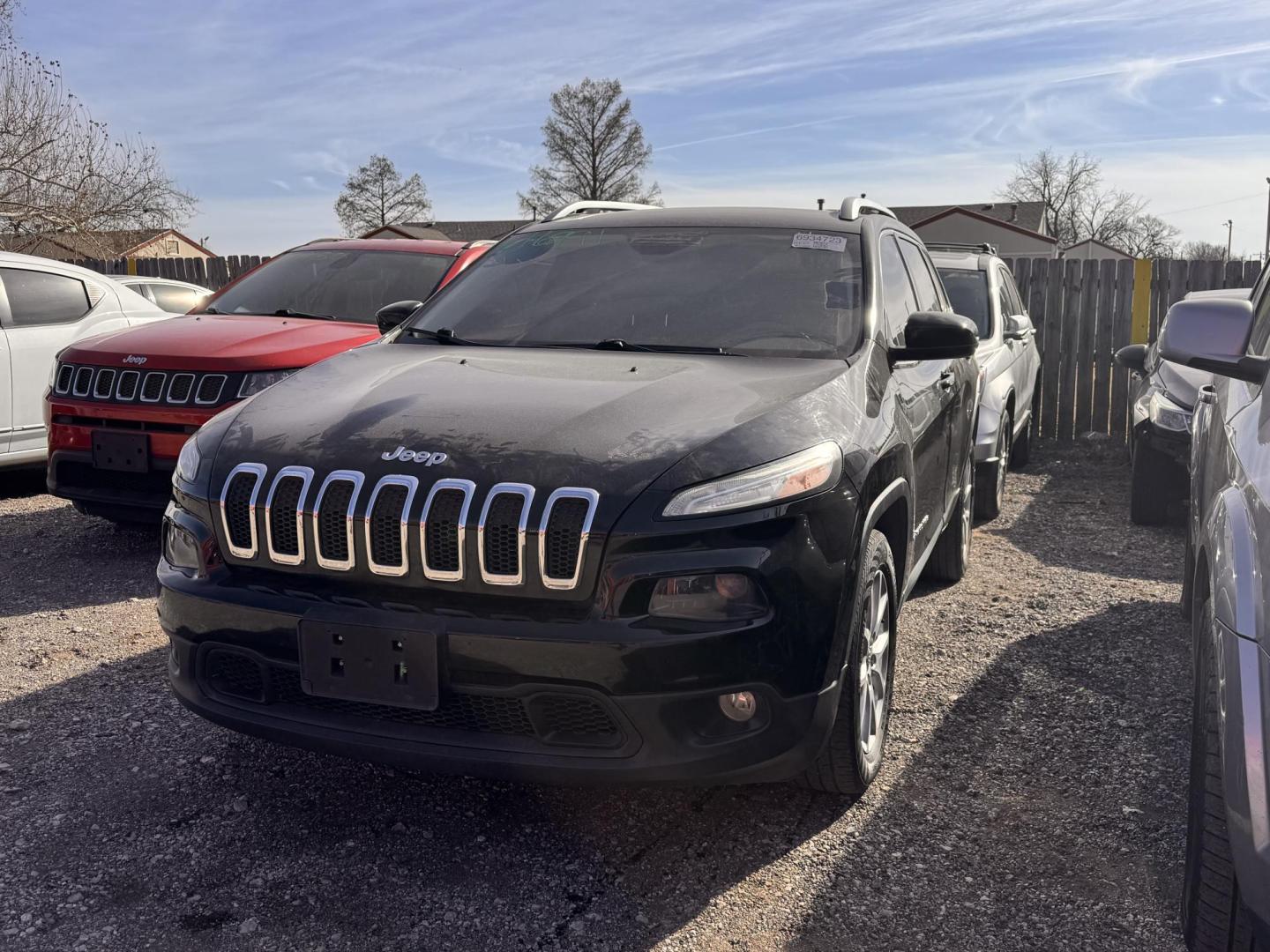 2017 BLACK Jeep Cherokee Latitude FWD (1C4PJLCB5HW) with an 2.4L L4 DOHC 16V engine, 9A transmission, located at 8101 E. Skelly Dr., Tulsa, OK, 74129, (918) 592-3593, 36.121891, -95.888802 - Photo#0