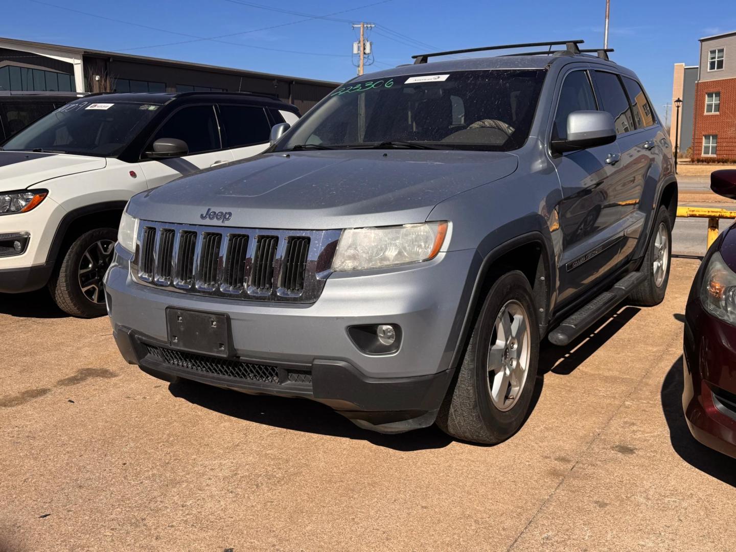 2012 BLUE Jeep Grand Cherokee Laredo 2WD (1C4RJEAG8CC) with an 3.6L V6 DOHC 24V engine, 5-Speed Automatic transmission, located at 8101 E. Skelly Dr., Tulsa, OK, 74129, (918) 592-3593, 36.121891, -95.888802 - Photo#0
