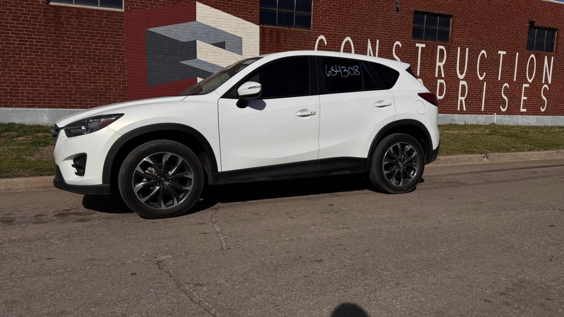 2016 WHITE Mazda CX-5 Grand Touring (JM3KE2DY5G0) with an 2.5L L4 DOHC 16V engine, 6-Speed Automatic transmission, located at 8101 E. Skelly Dr., Tulsa, OK, 74129, (918) 592-3593, 36.121891, -95.888802 - Photo#0