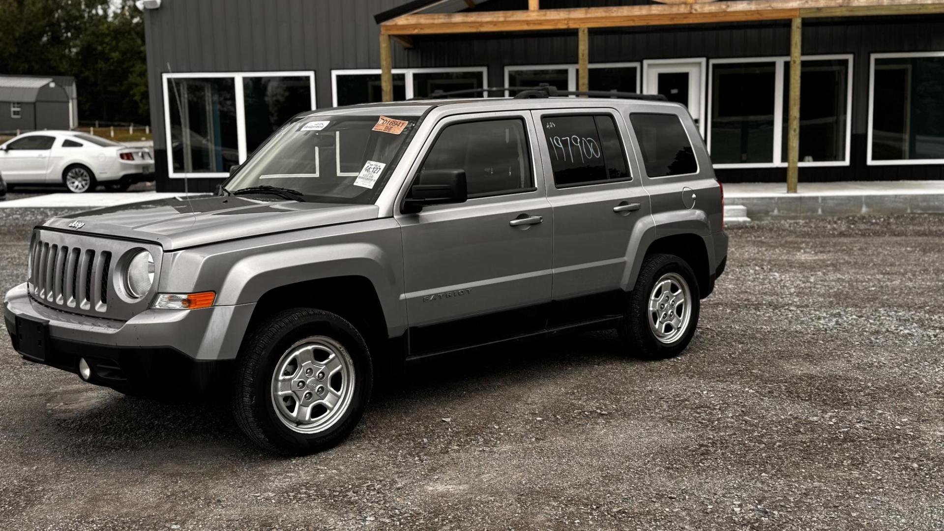 2015 SILVER Jeep Patriot Sport 4WD (1C4NJRBBXFD) with an 2.4L L4 DOHC 16V engine, located at 8101 E. Skelly Dr., Tulsa, OK, 74129, (918) 592-3593, 36.121891, -95.888802 - Photo#0